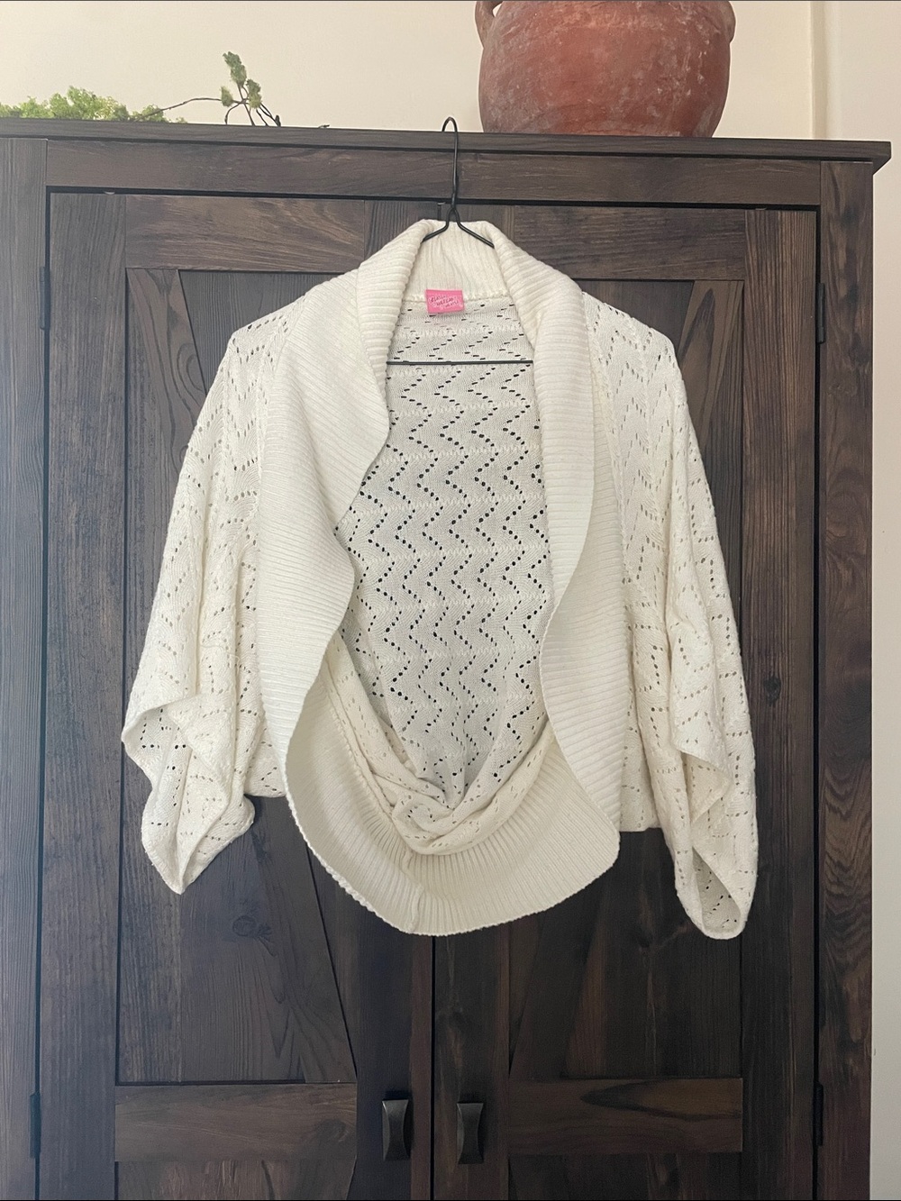 Cardigan sweater with draping detail